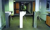 Single waist height turnstile with slotted tops